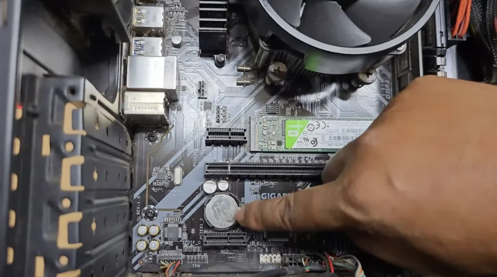 PC Won't Boot? — Step-by-Step Fix Guide (2026) 2 Close-up view of a CR2032 CMOS battery installed on a desktop PC motherboard, showing the battery location used for BIOS reset and CMOS clearing.