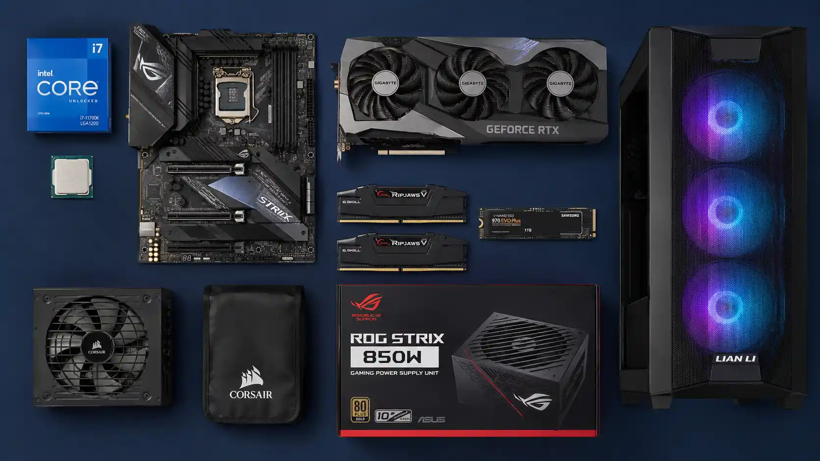 Flat lay product photography of PC components including CPU, motherboard, graphics card, RAM, NVMe SSD, power supply and PC cabinet arranged neatly on a dark navy blue background.
